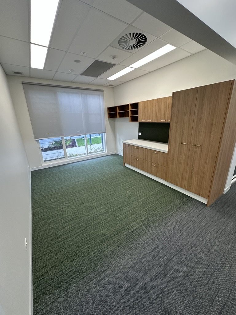 Office with hard-wearing carpet tiles and joinery