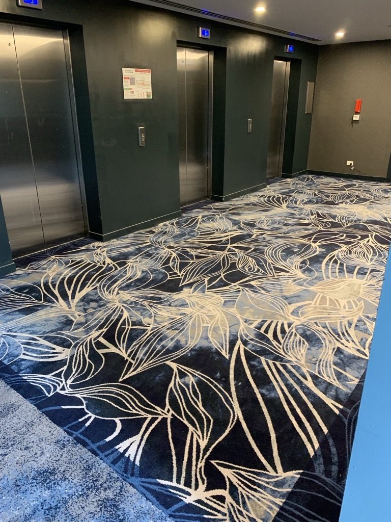 Bespoke floral-patterned hotel lobby carpet