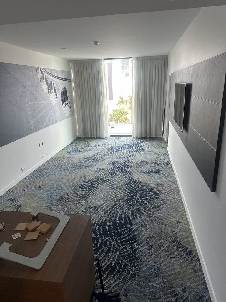 Hotel room carpet with city and palm views